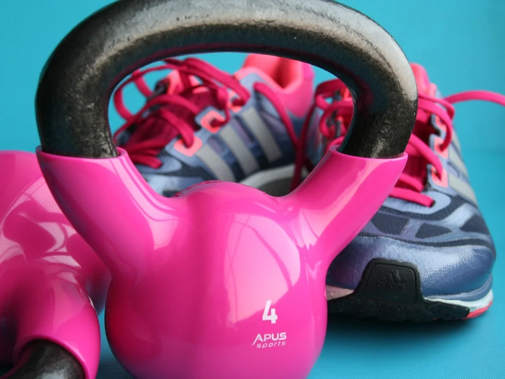 Pink kettlebell and training shoes at The Fitter Female studio